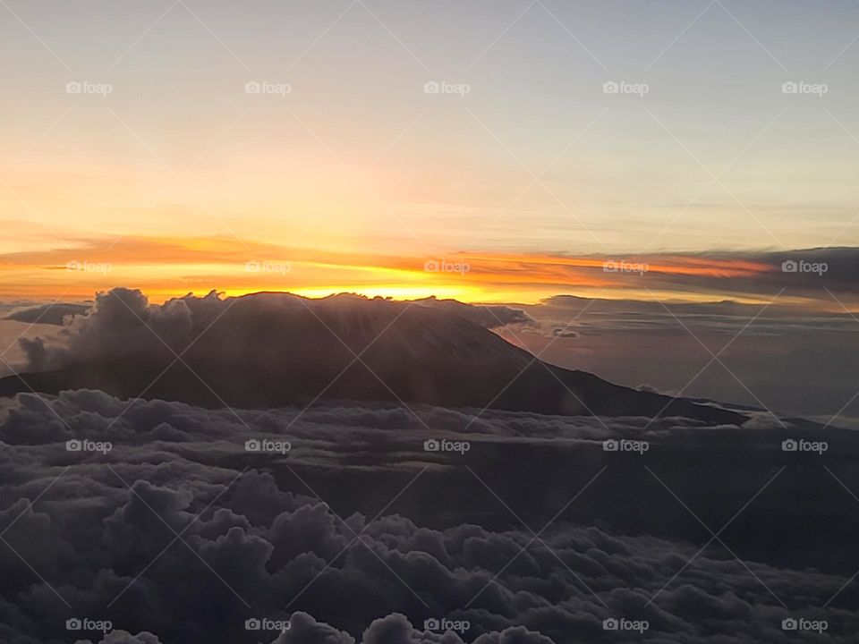 Kilimanjaro at sunset, over the clouds