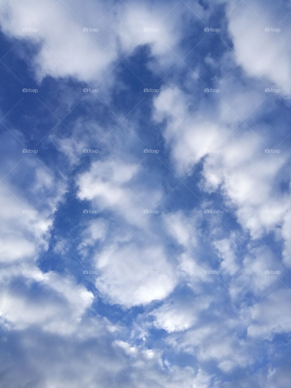 Background of beautiful white clouds on blue sky.
