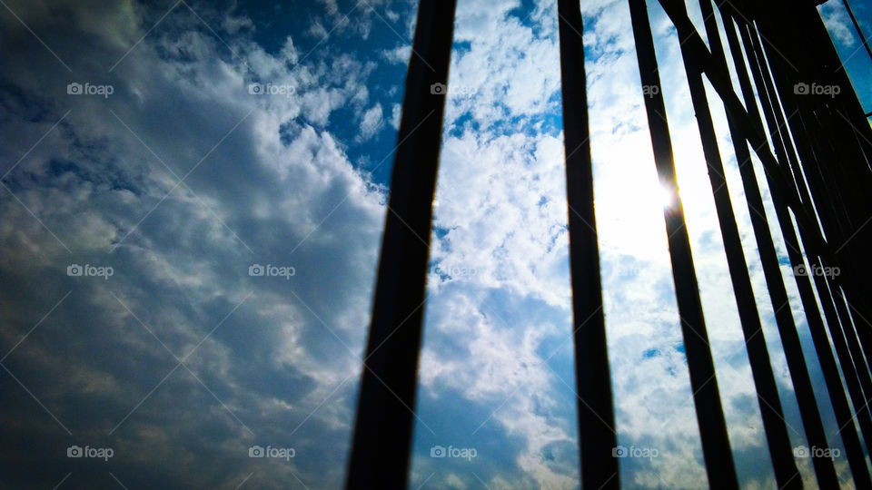 cloud and sky through silhouette window frame
