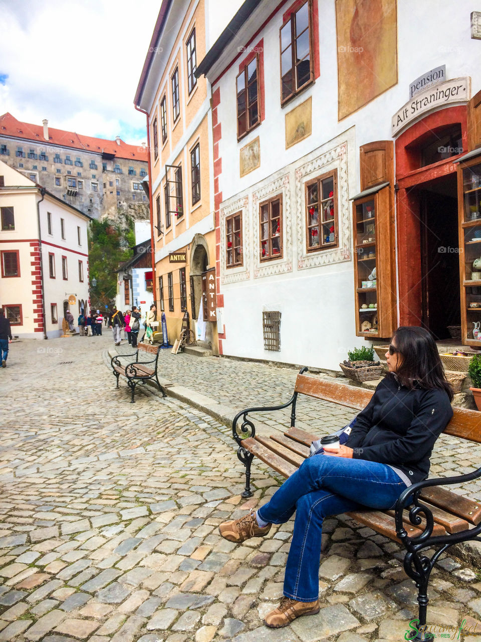 Woman sitting on a bench in Czech Republic 