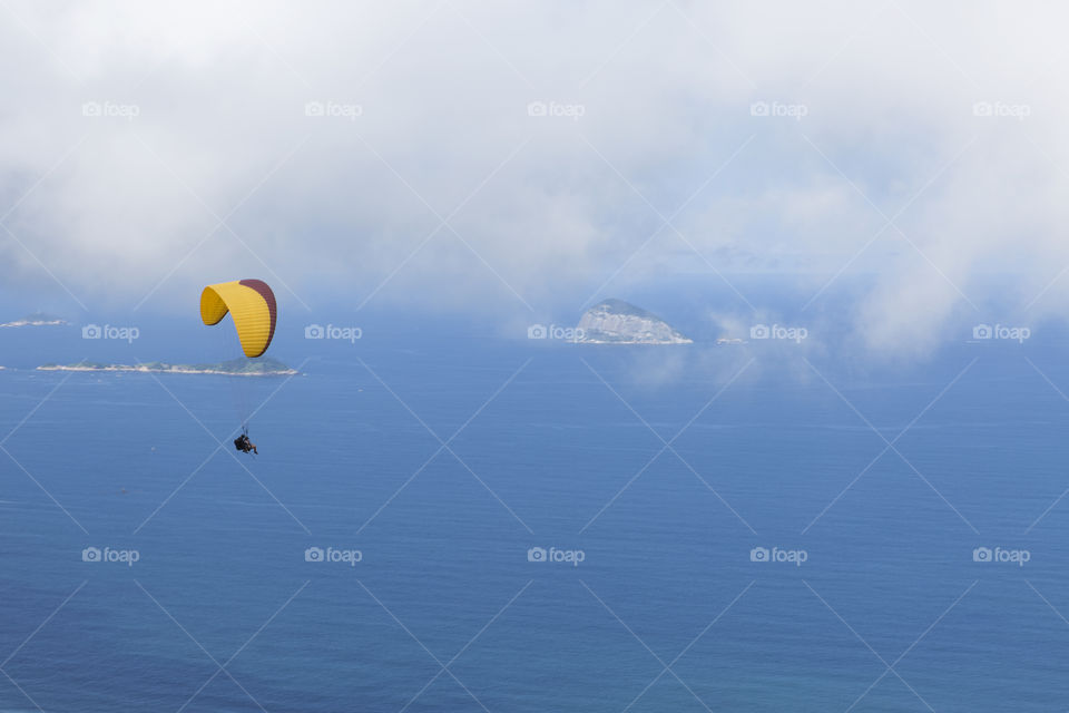 Paraglider flying over Sao Conrrado in Rio de Janeiro Brazil.