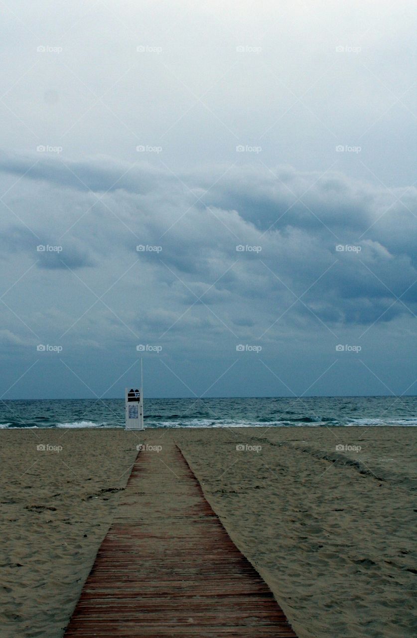 Cute couple on beach tower, Italy, October.
