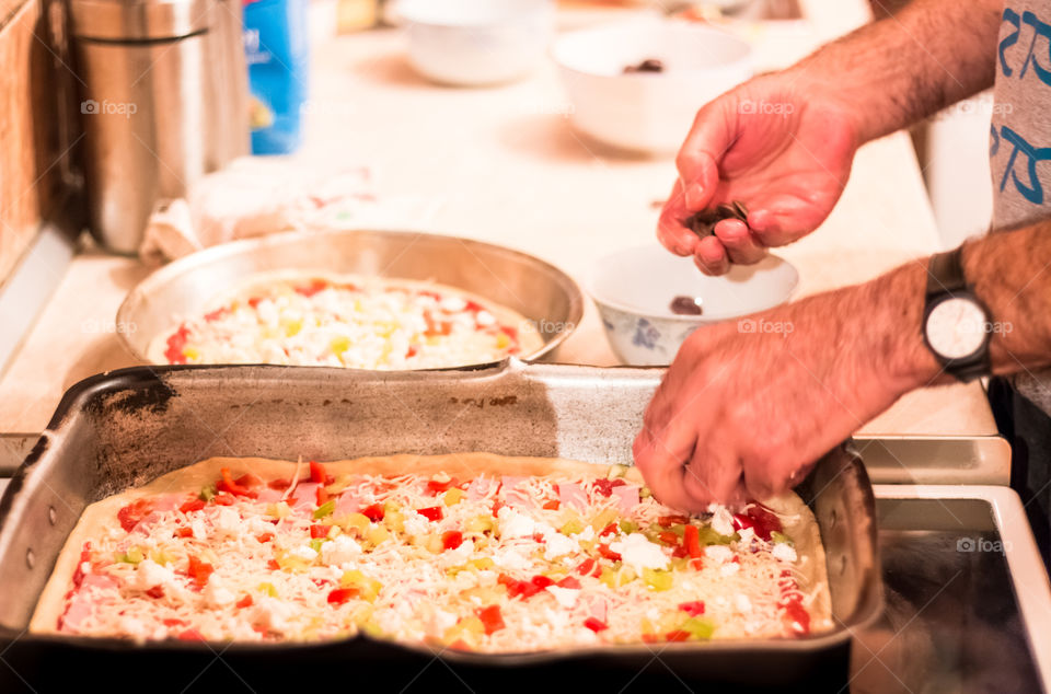 Man Prepares And Cooking Pizza At Home
