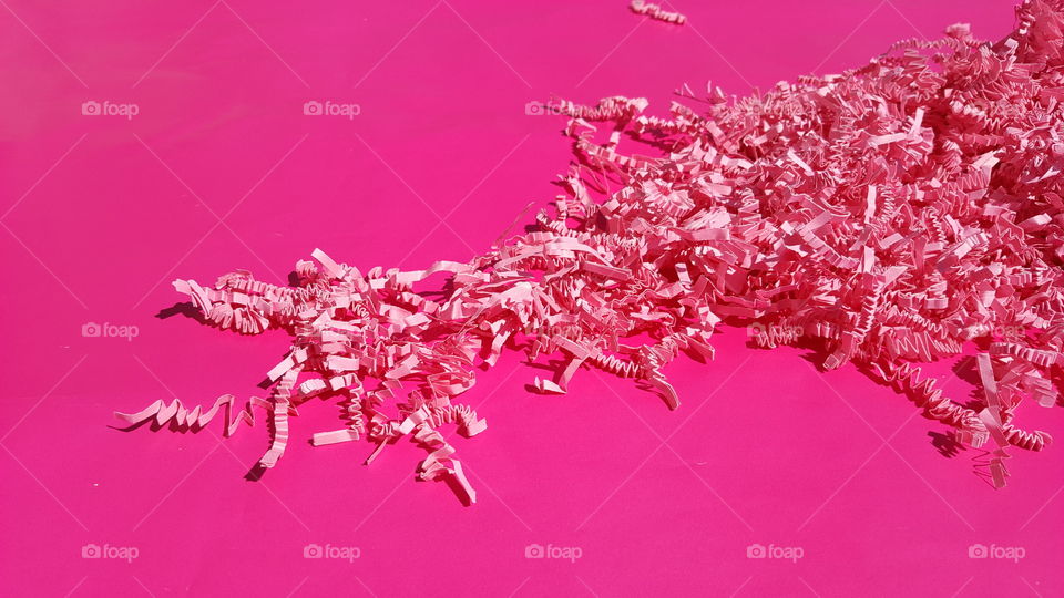 Confetti on pink background
