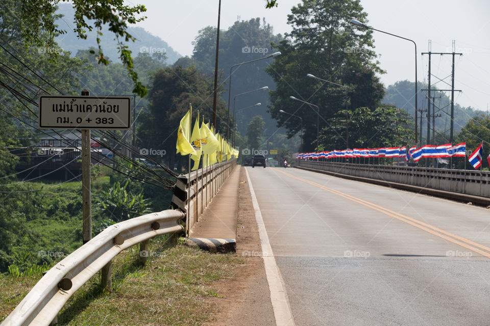 Road Bridge with flag in Thailand 