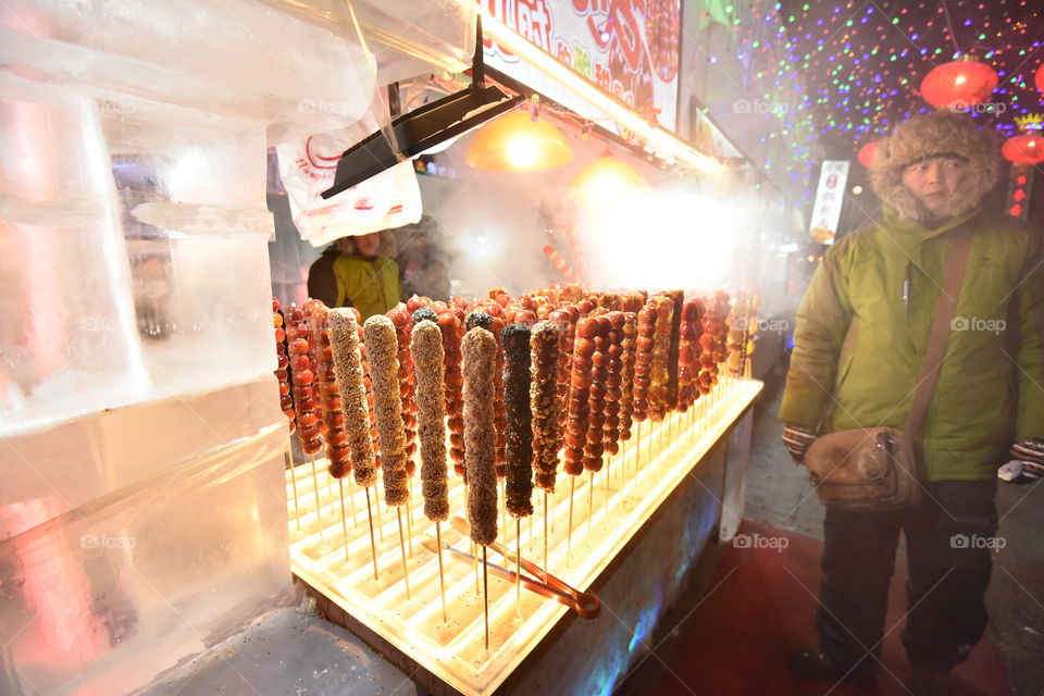 Asia, china streer food, the famous sauer fruit with candy