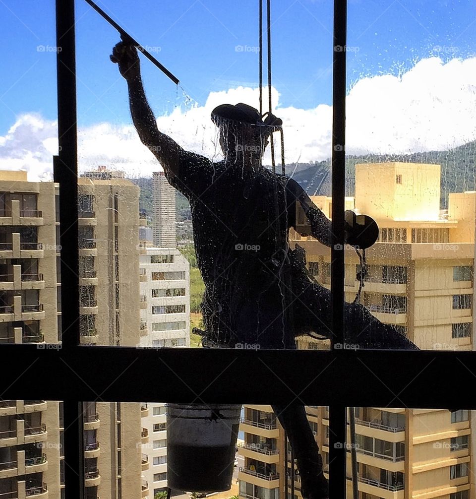 Window washer working on high-rise building
