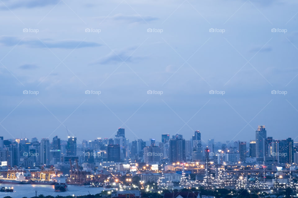 Beautiful of skyscraper in twilight and fog after rain