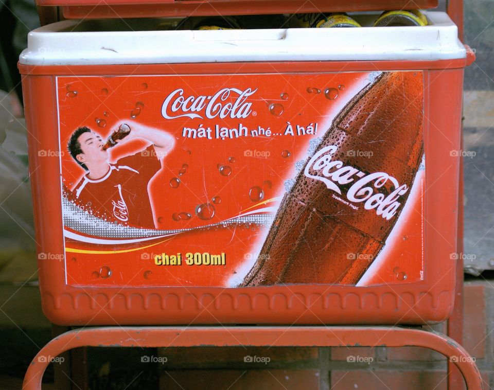 Hanoi, Vietnam- A Coca Cola cooler being displayed to promote the sale of cold soft drinks.