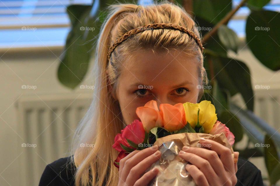 Woman smelling rose bouquet