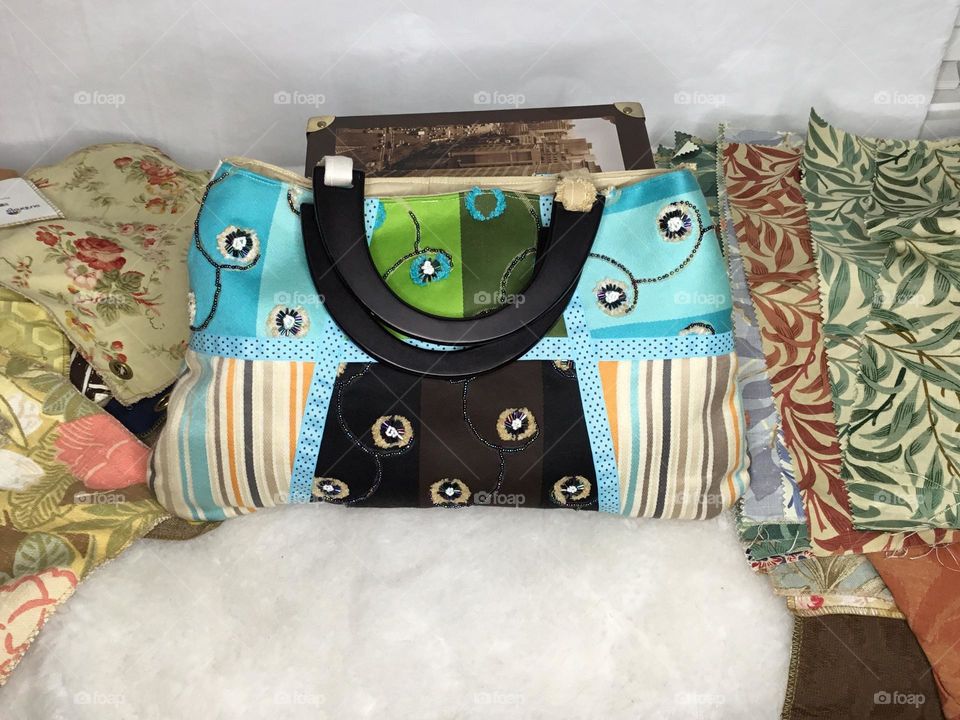 Patchwork Purse is a unique, one of a kind bag, in a gorgeous assortment of prints and solid fabric samples and remnants that create a neutral yet versatile 