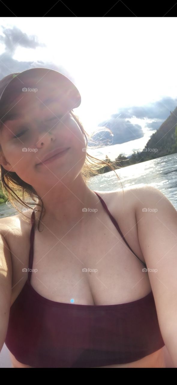 College girl out for an afternoon float on the river. 