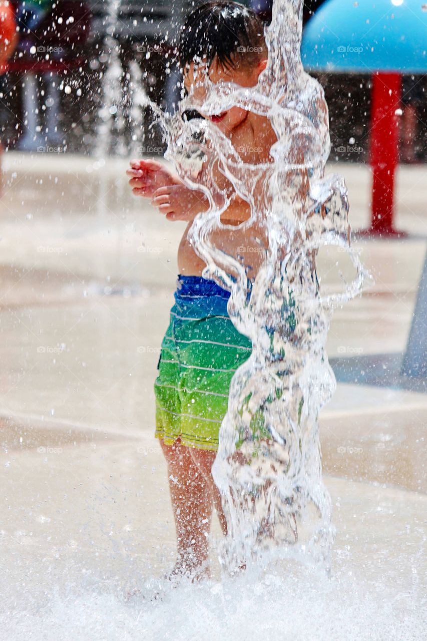 Boy playing in water