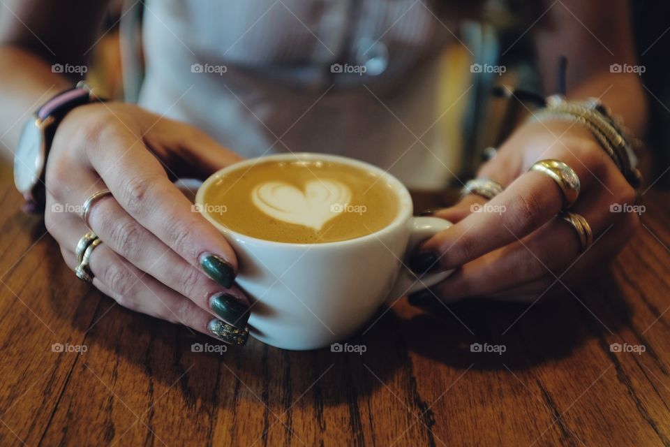 Hands holding a heart. 