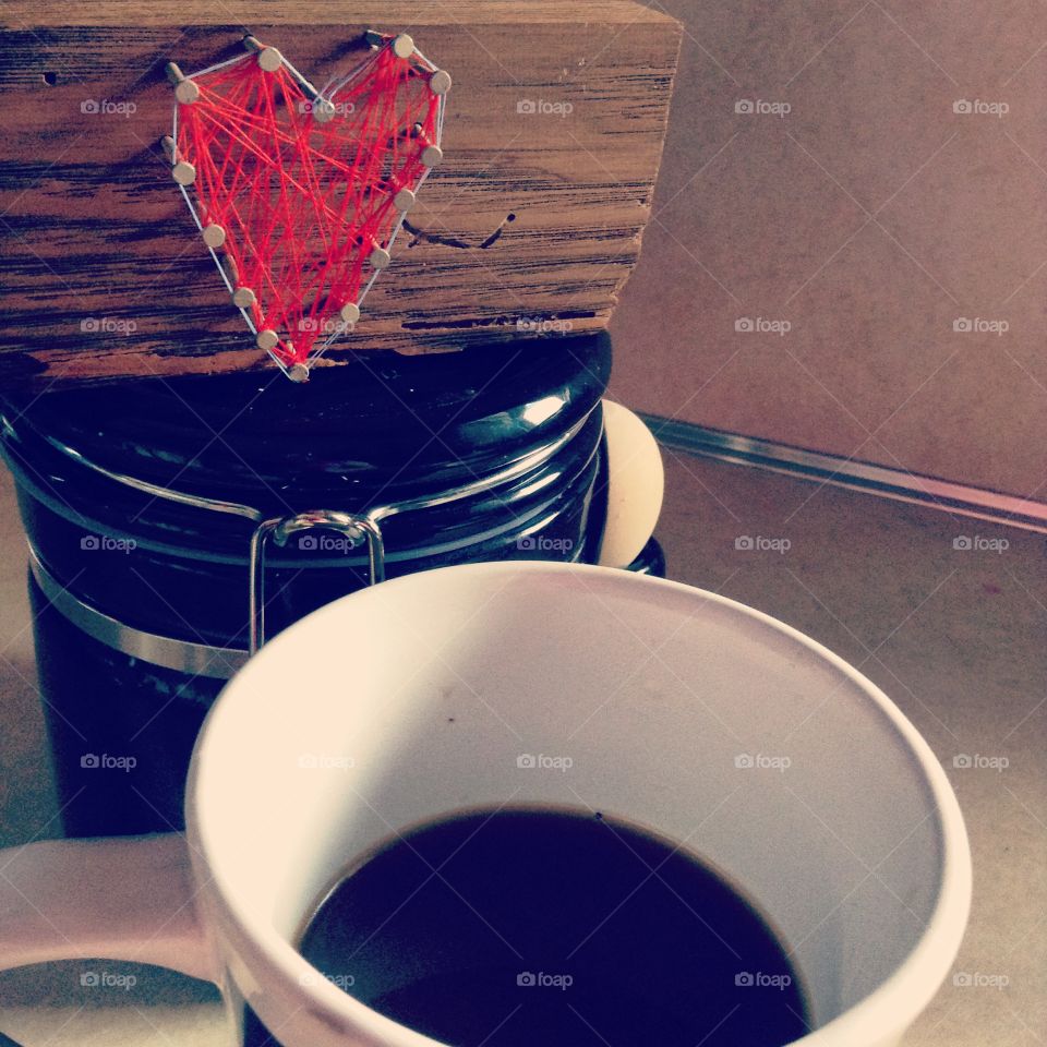 Coffee Love. A shot of morning coffee with heart in background.