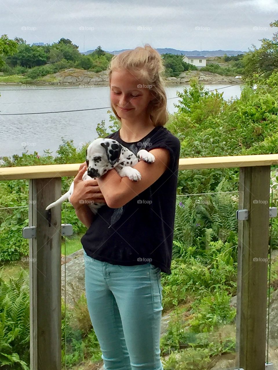 Young woman holding her pet dog