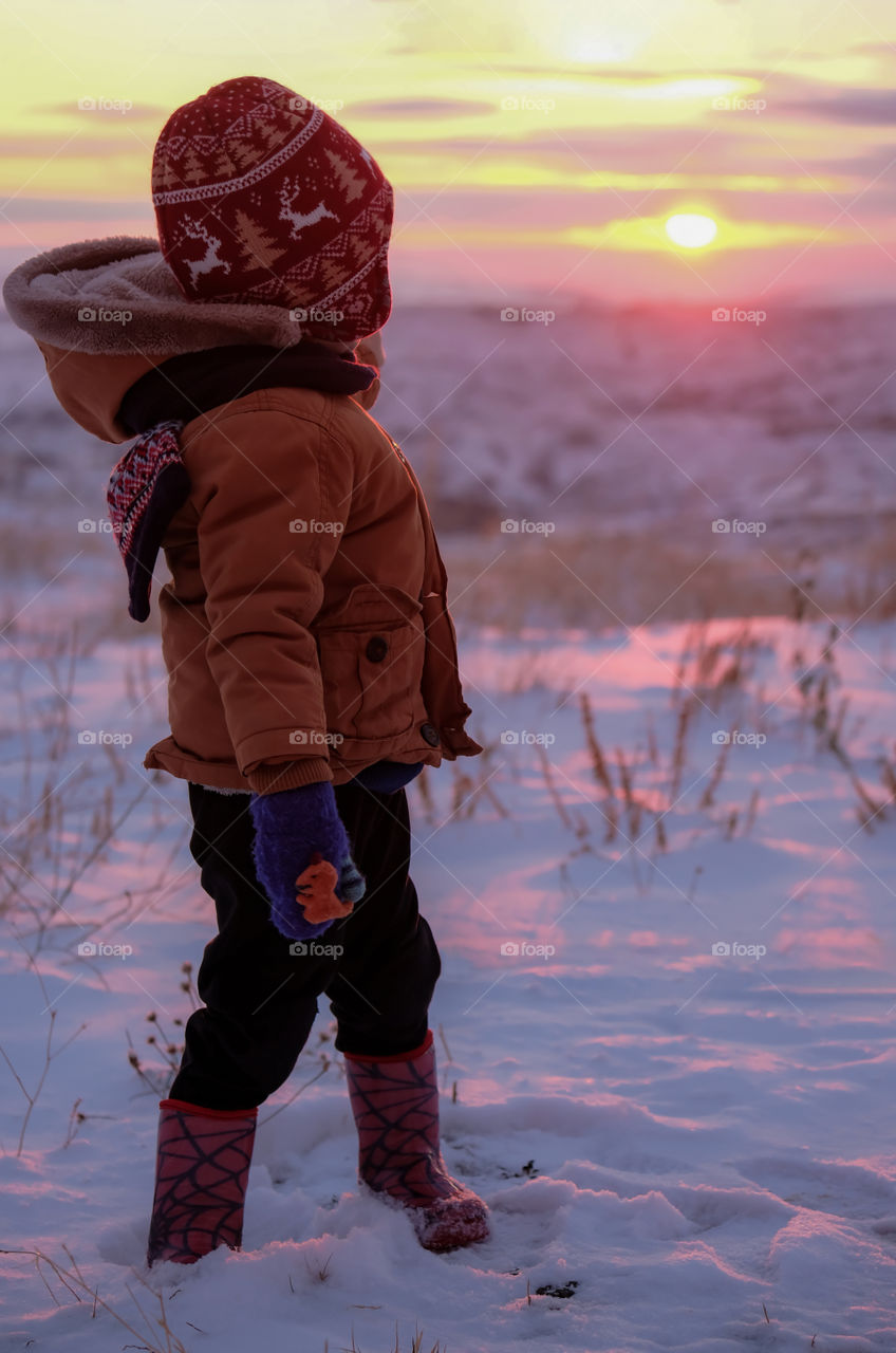 Boy watching sunset