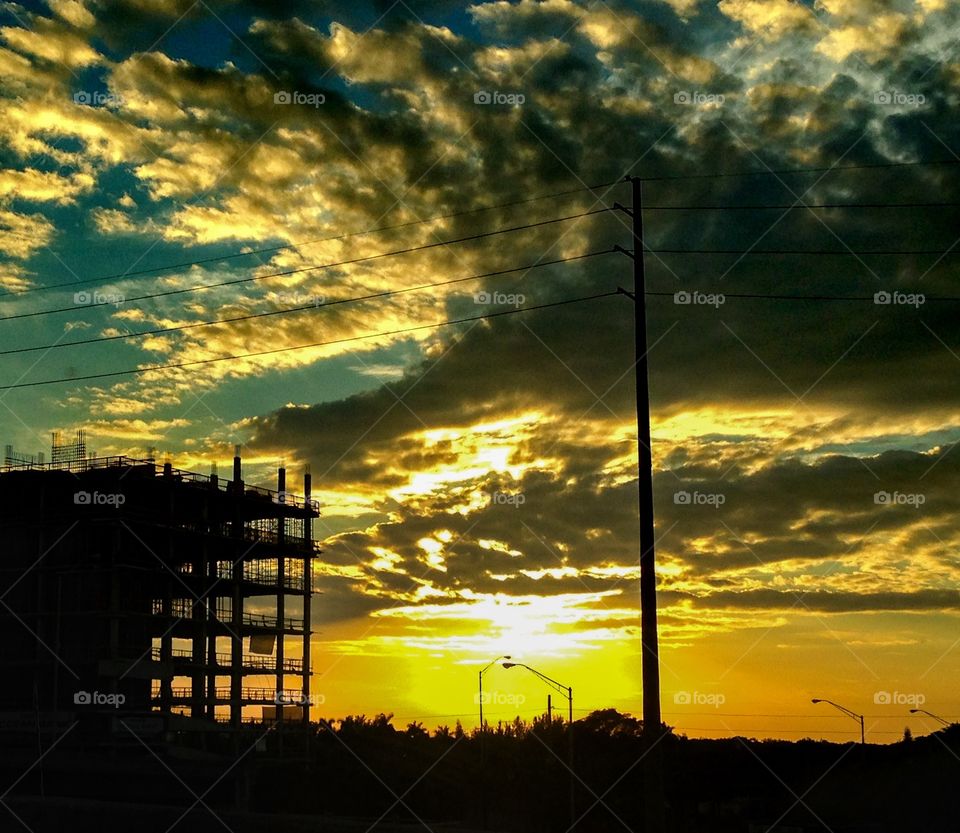 Sunshine . Sun behind construction 