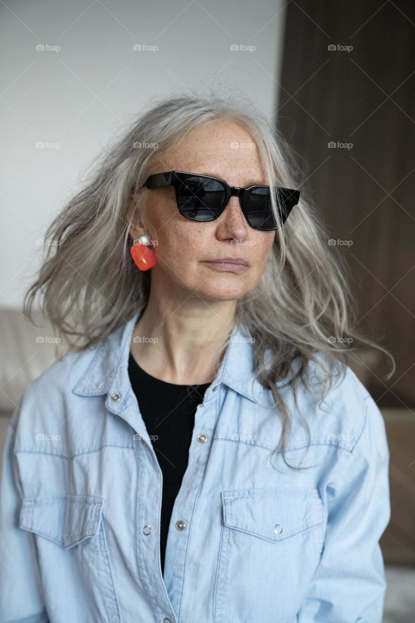 Silver hair woman wearing sunglasses 