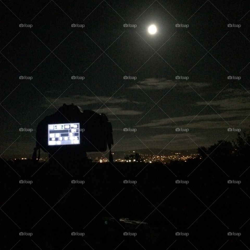 Eclipse. Camera capturing the eclipse at night outside of the city.