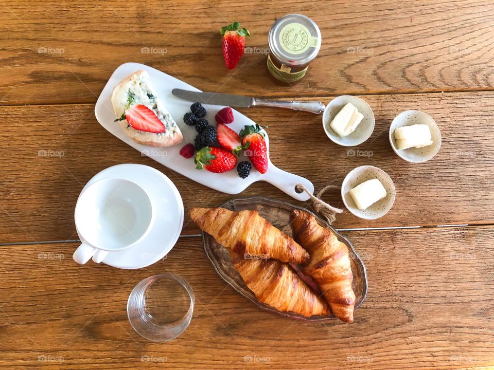 Beautiful breakfast with croissants strawberries and cheese beautiful serving