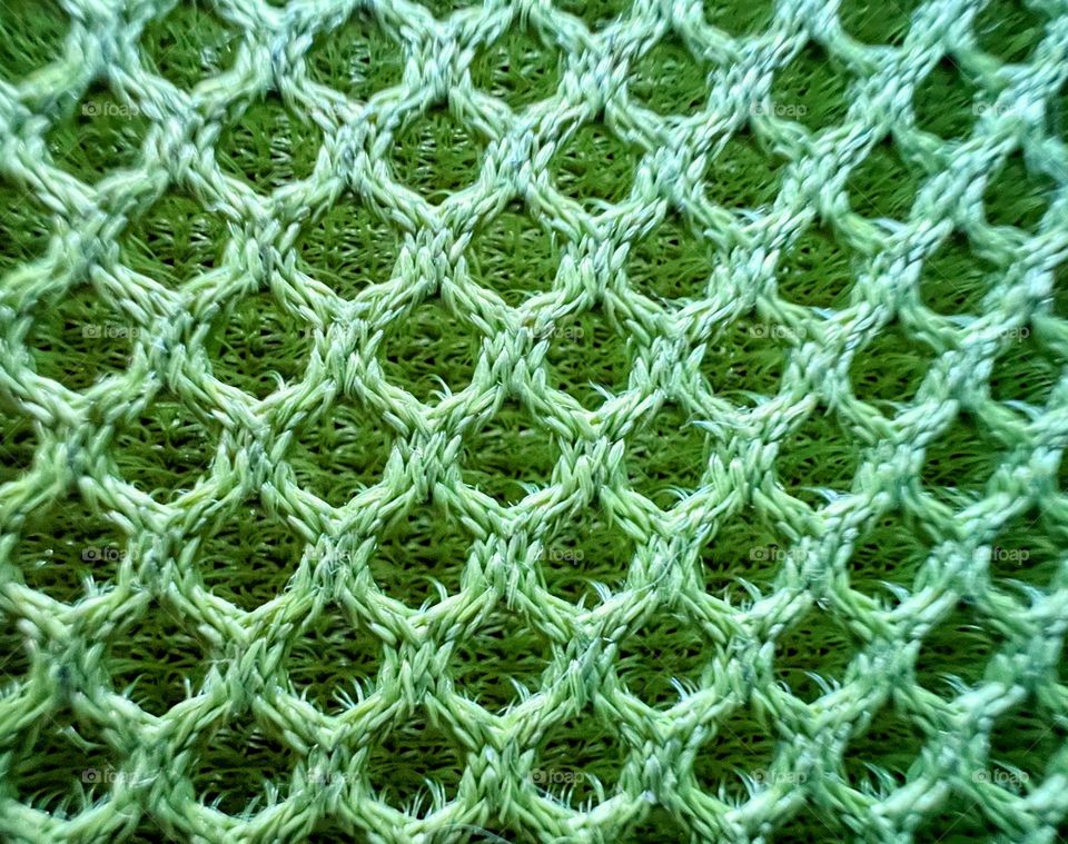 Green close up abstract futuristic mesh shape surface background