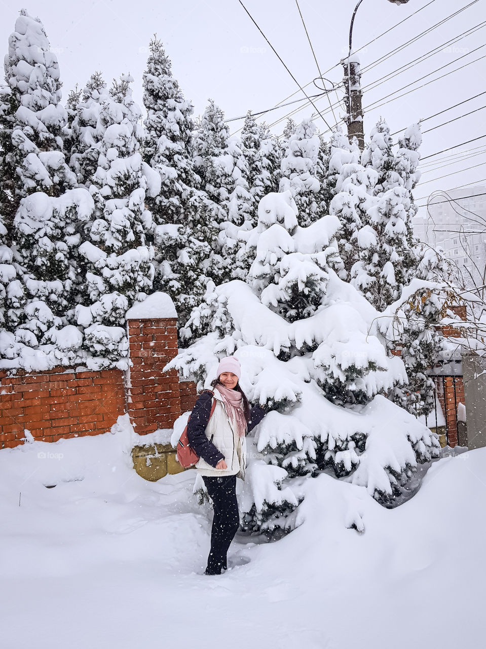 Winter day with a lot a snow and smiling person.