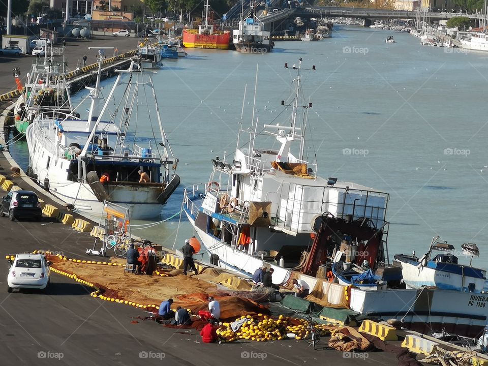 Men at work in an harbor