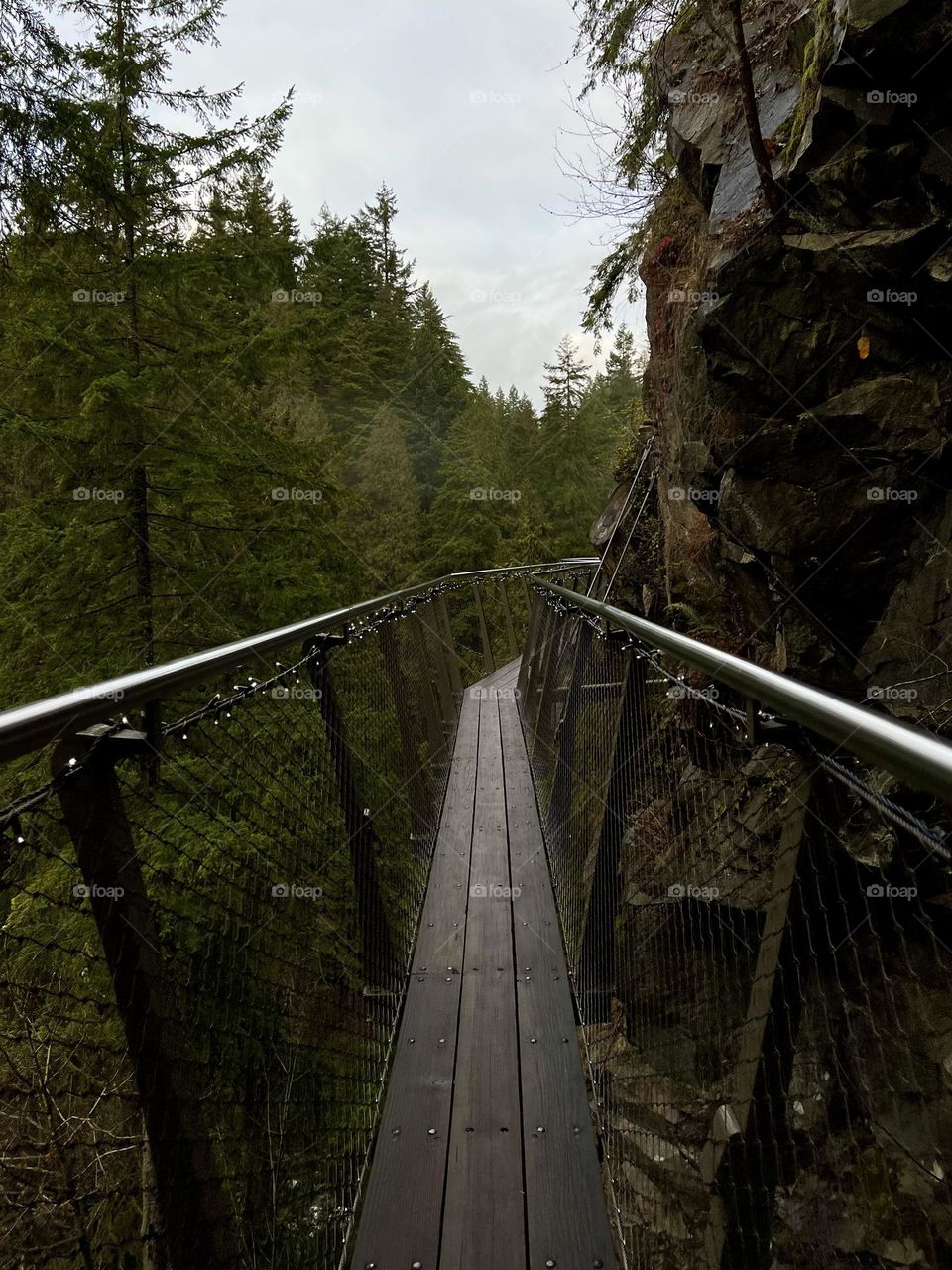 Walking along the Cliffwalk at Capilano Suspension Bridge Park in North Vancouver British Columbia