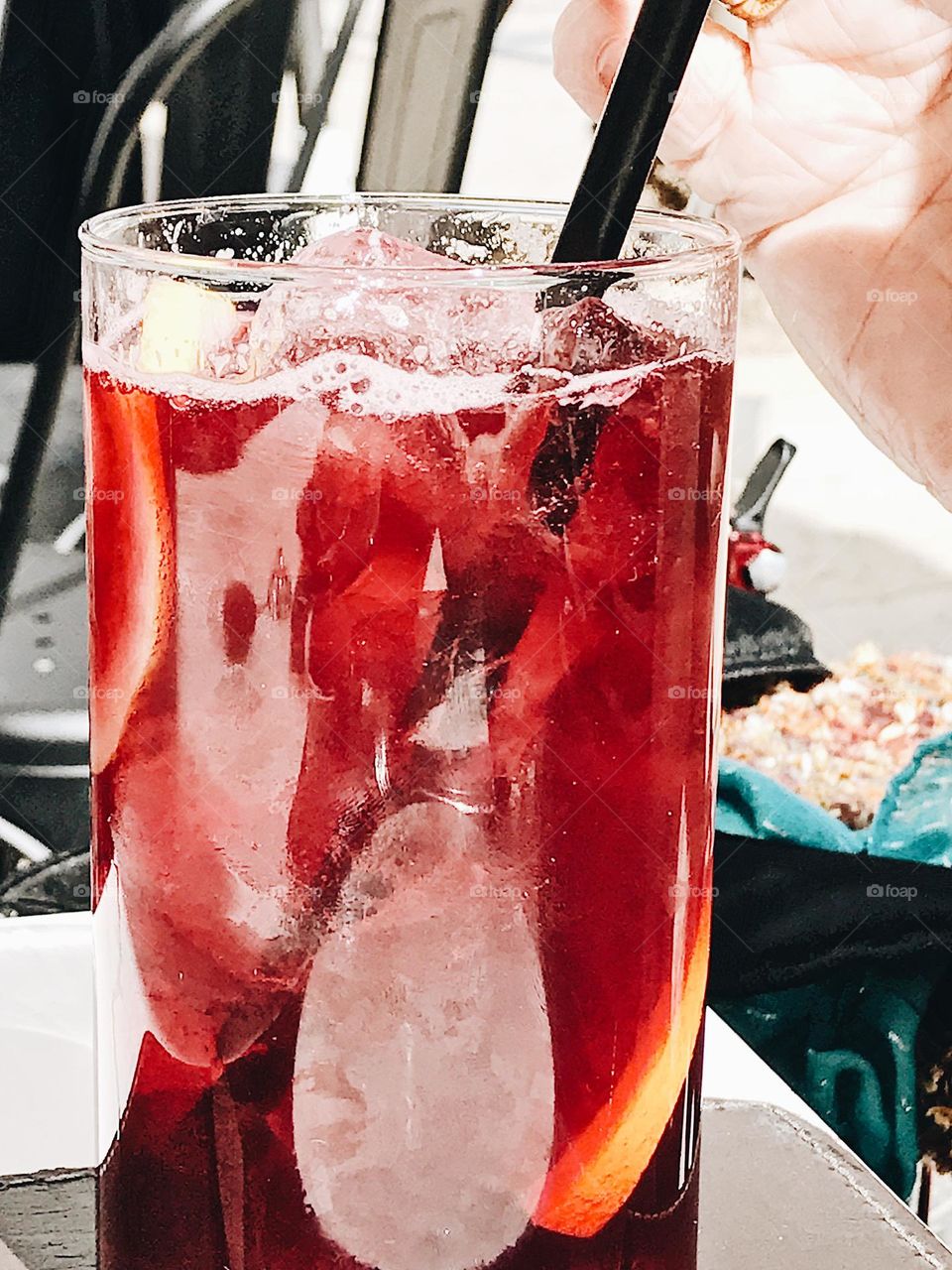 Red refreshing drink in a glass closeup 