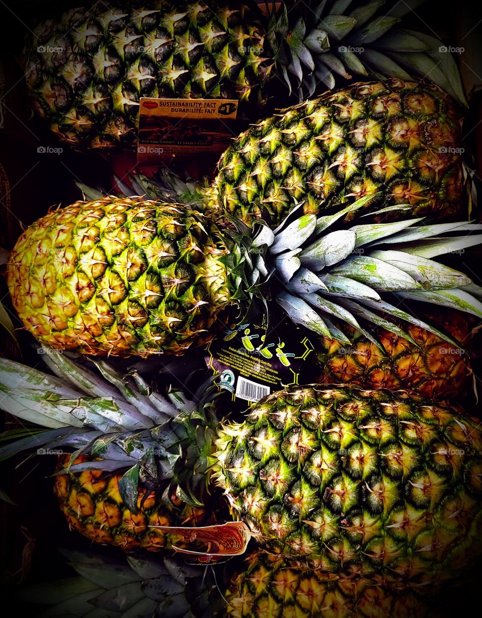 Stacked pineapples at the market