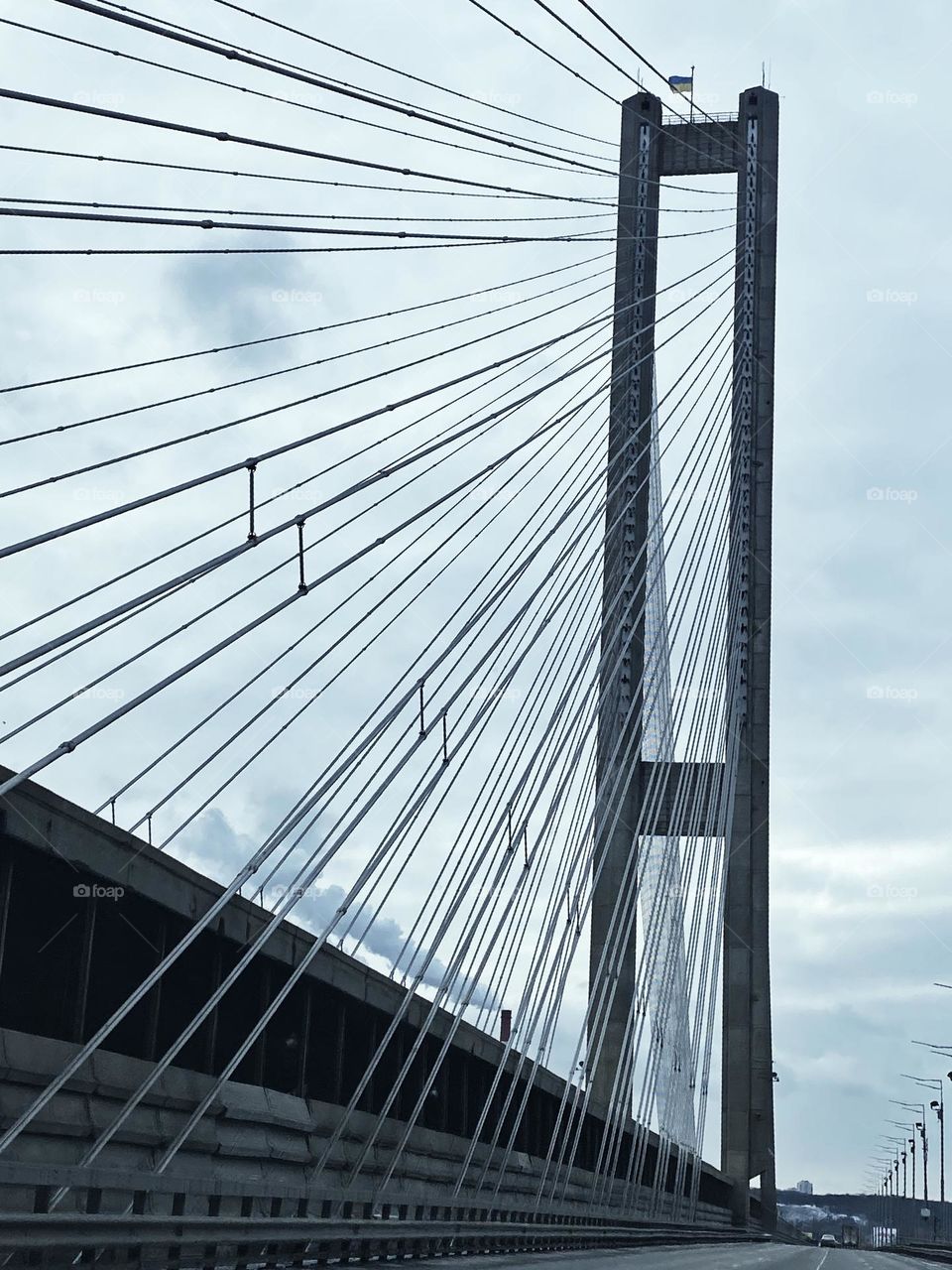 a large concrete bridge with cables