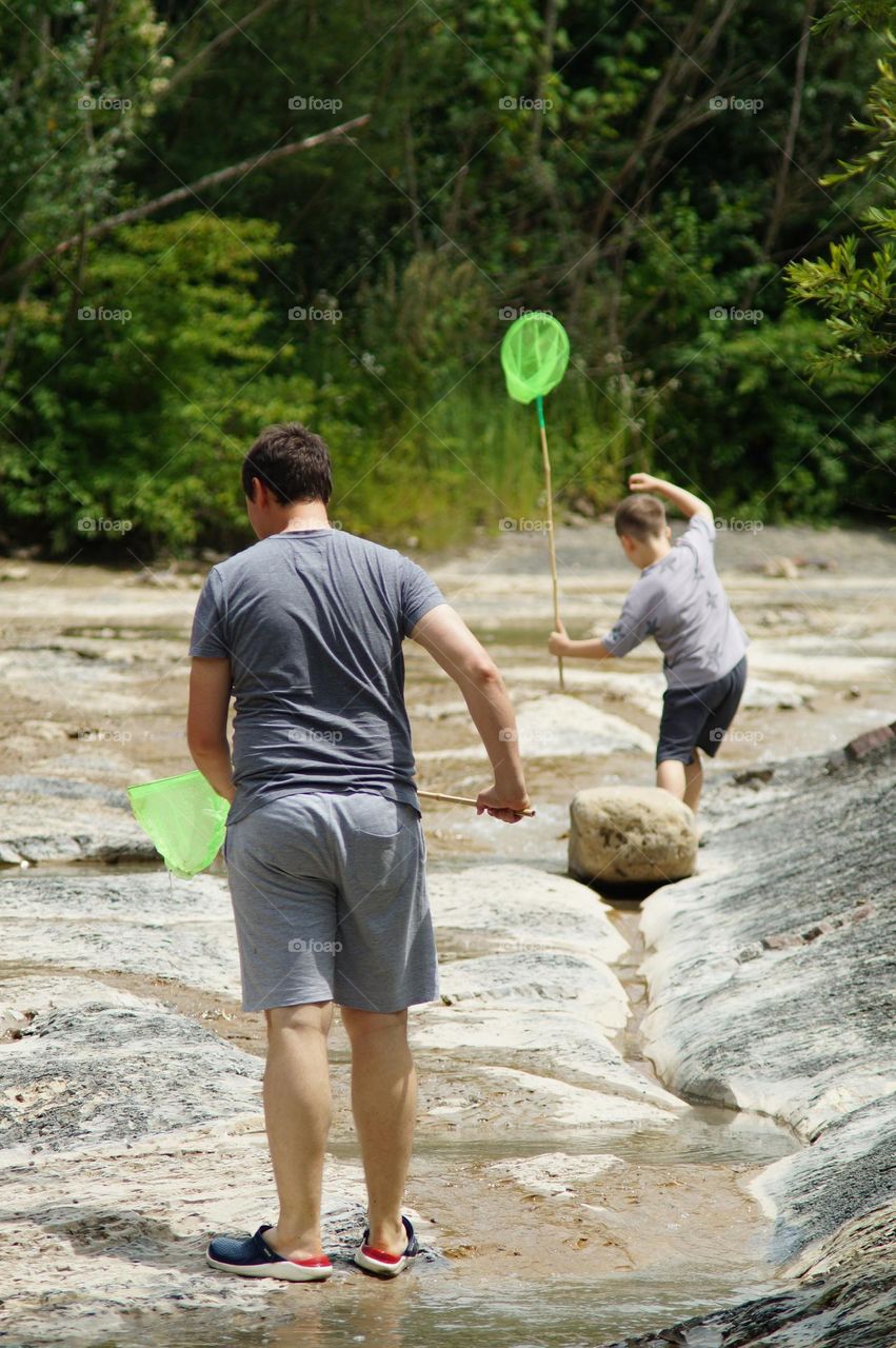 Father and son Fishing on a mountain river