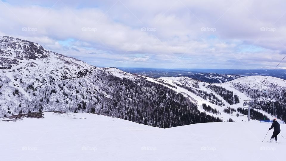 Skier on a snowy ridge