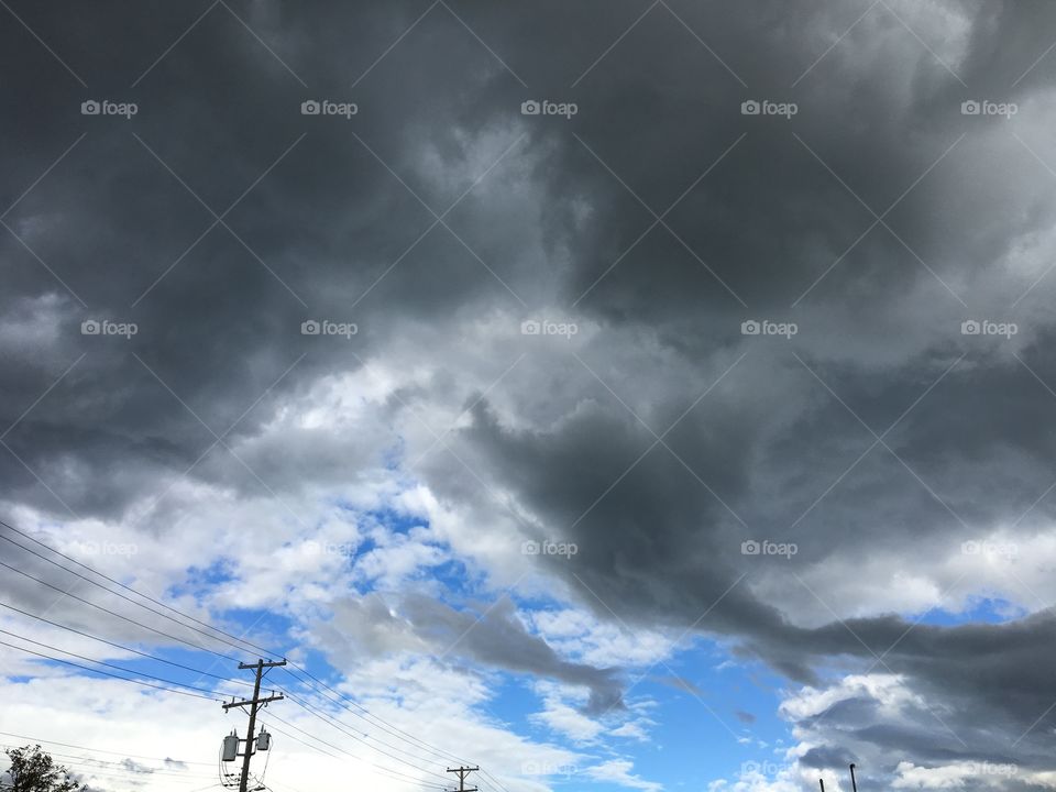 Blue skies and dark clouds