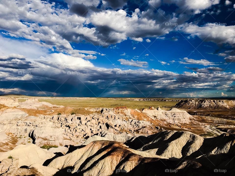 Rock formations and partly cloudy sky in Petrified Forest National Park 