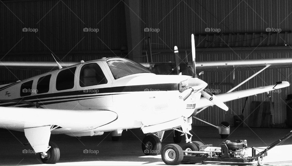 Light aircraft in hangar