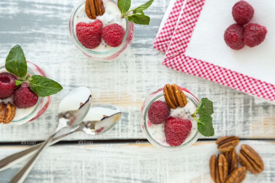 High angle view of yogurt with raspberry