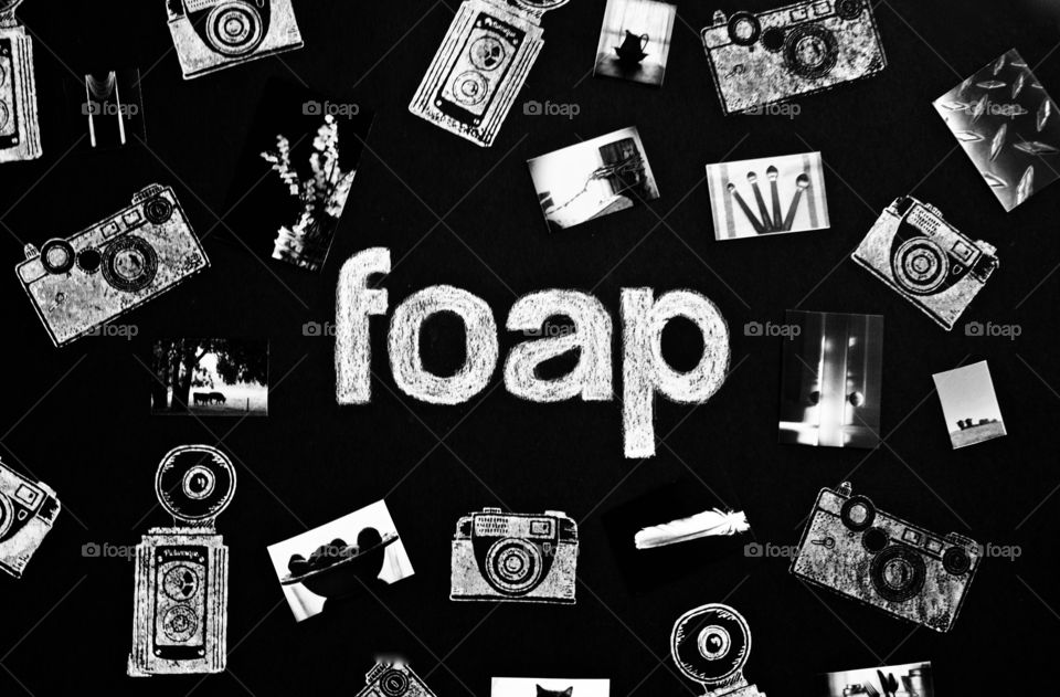 Foap Premium Mission - The word “foap” handwritten in chalk on black background with collage of miniature black and white photos and chalk illustrations of vintage cameras 