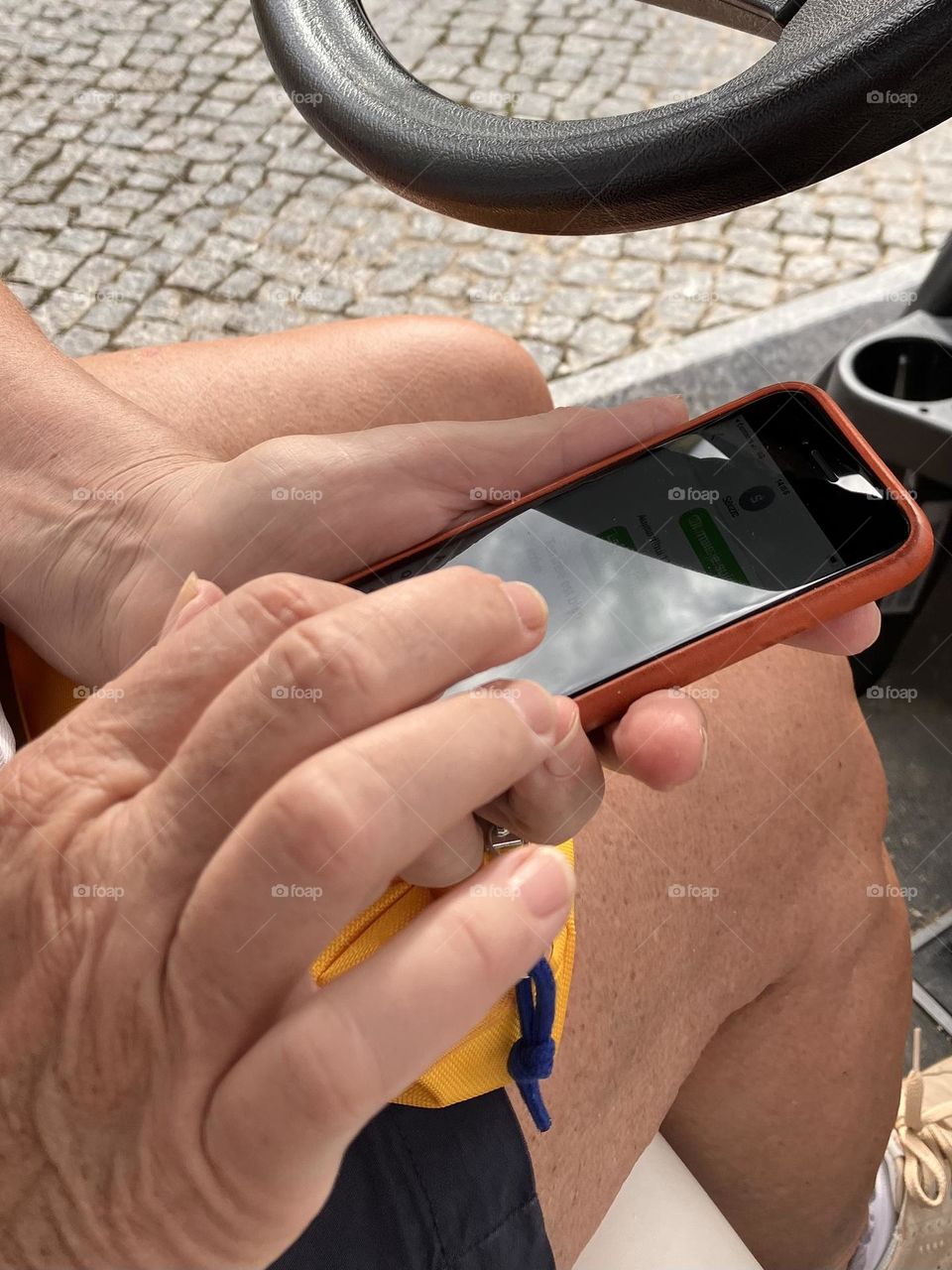 Woman’s hands on her phone