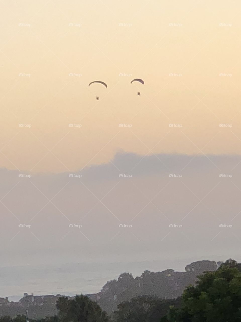 Two paragliders over the ocean.  Eyes in the sky