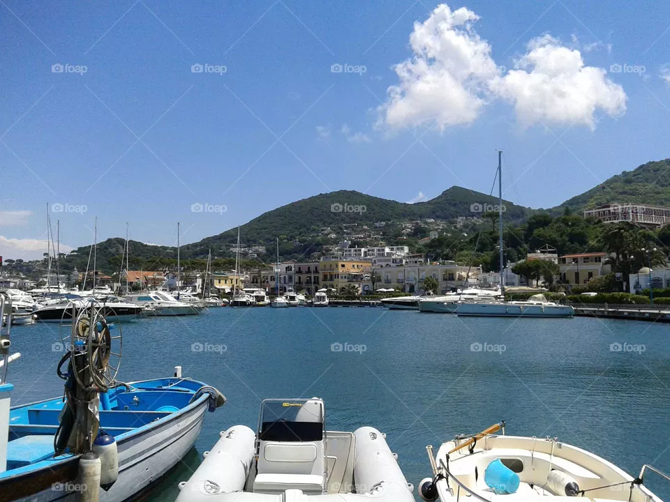 Boats moored in the port of Casamicciola on Ischia (island of the Gulf of Naples, Italy) on a sunny day