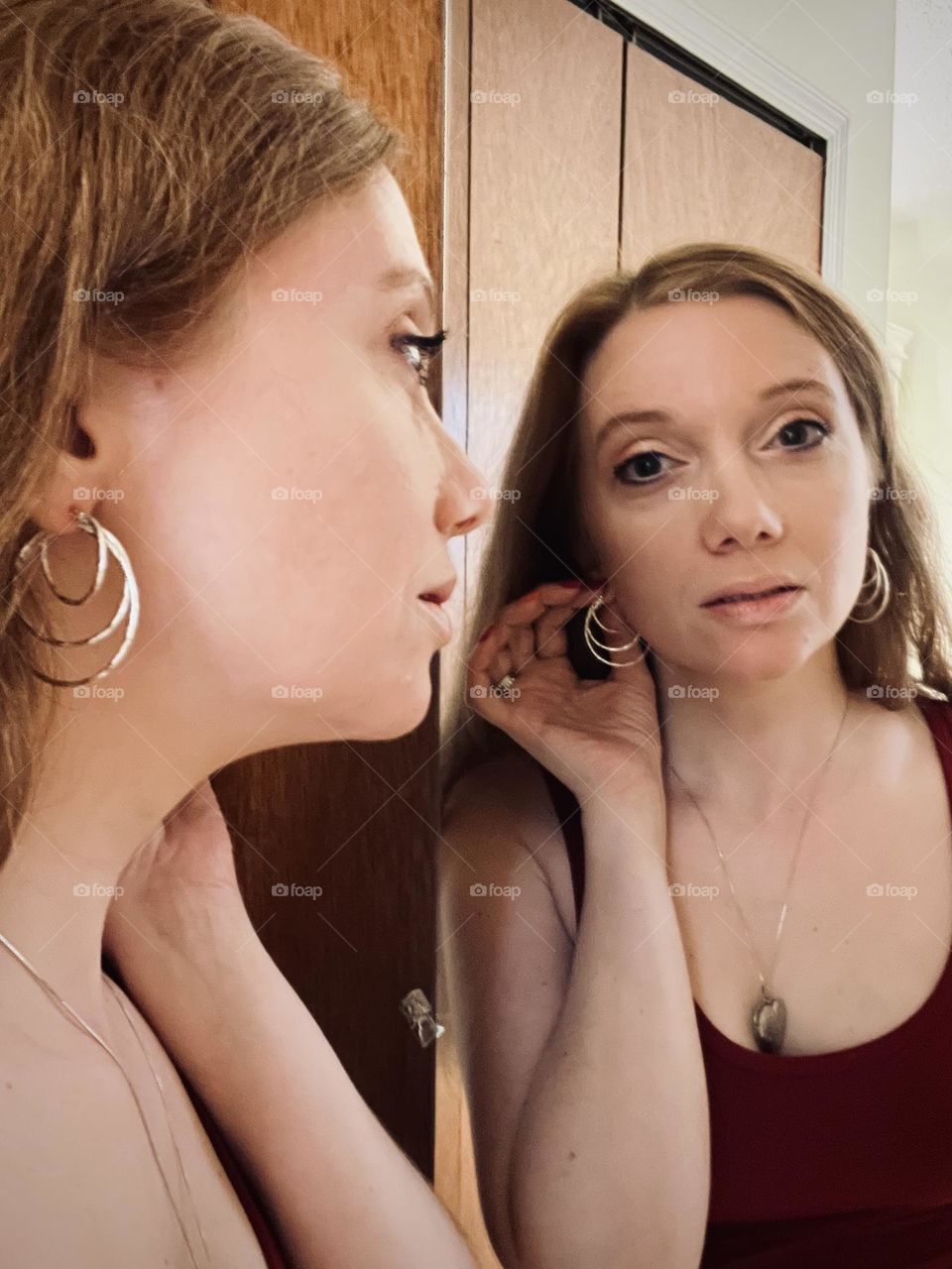 Putting on my earrings in before leaving the house 