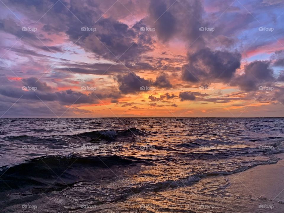 
Gorgeous orange, pink and blue hues leave spectators in awe as the sun makes its way toward the horizon