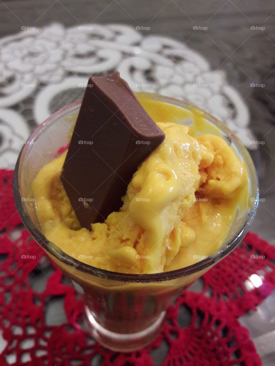 dew frost chocolate beam rectangle on creamy white fat of coco beans icecream melting red croquet