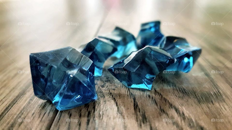 Dark blue gemstones on table
