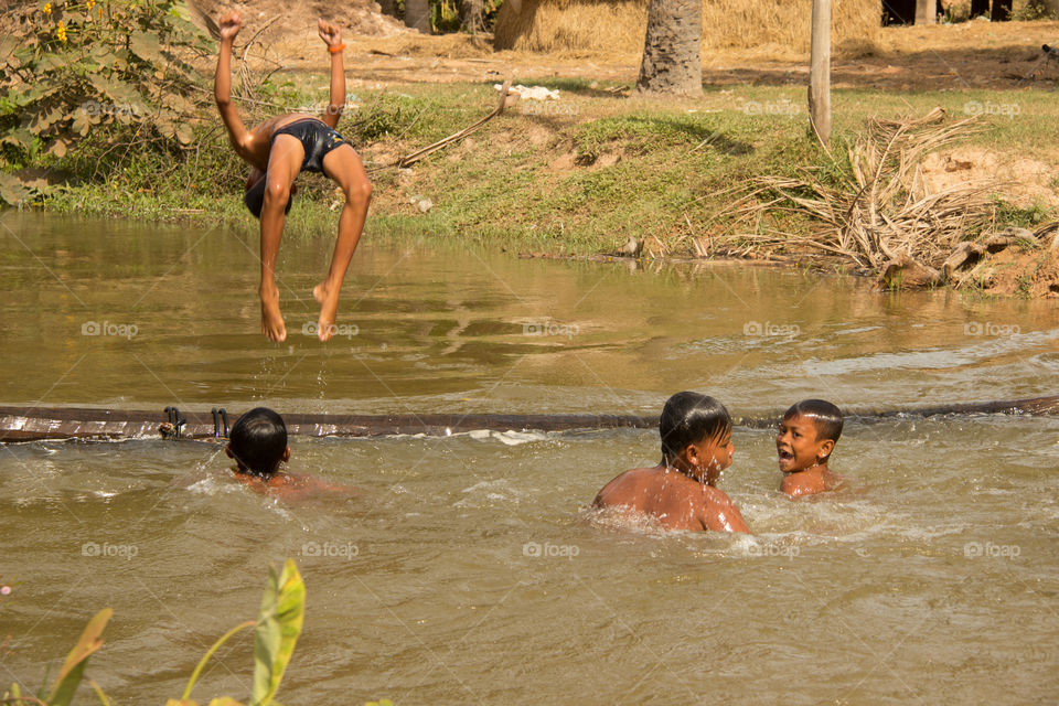 Playing in the water in Cambodia