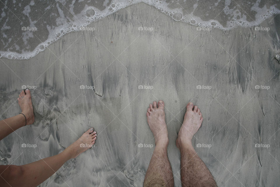 legs on the sand