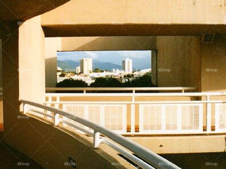 View of Cairns through a cutout in a building.