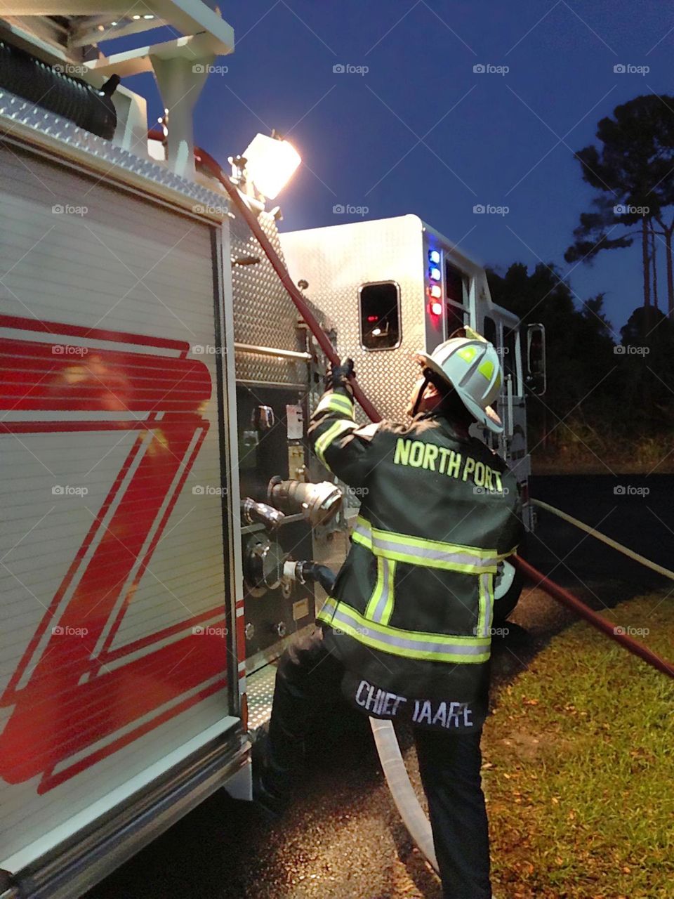 Big metal fire engine and fireman.